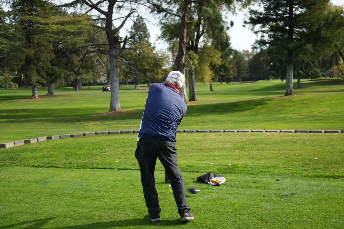 A veteran drives from the tee at the 2025 outing