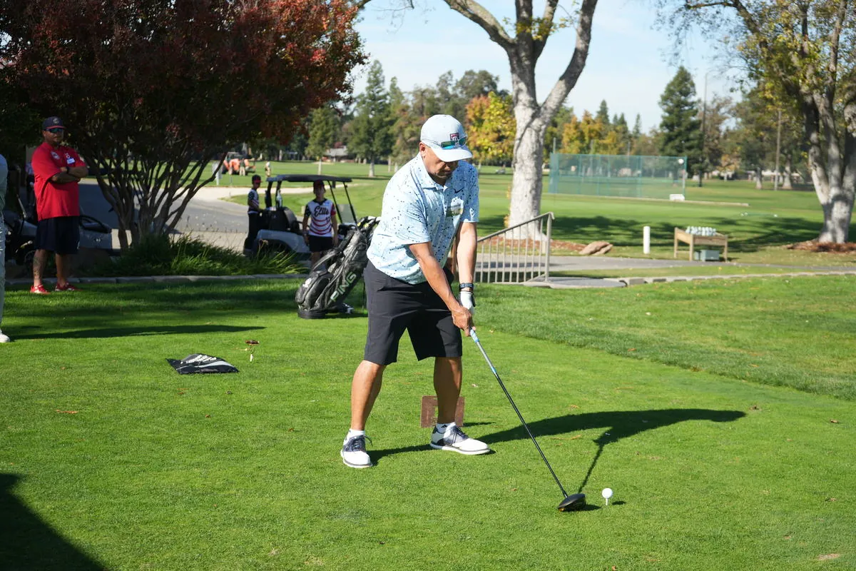 A participant lines up a putt